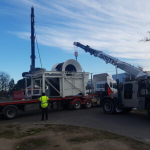 wind tunnel being loaded on to truck