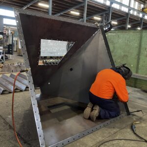 Engineer works on part of wet scrubber