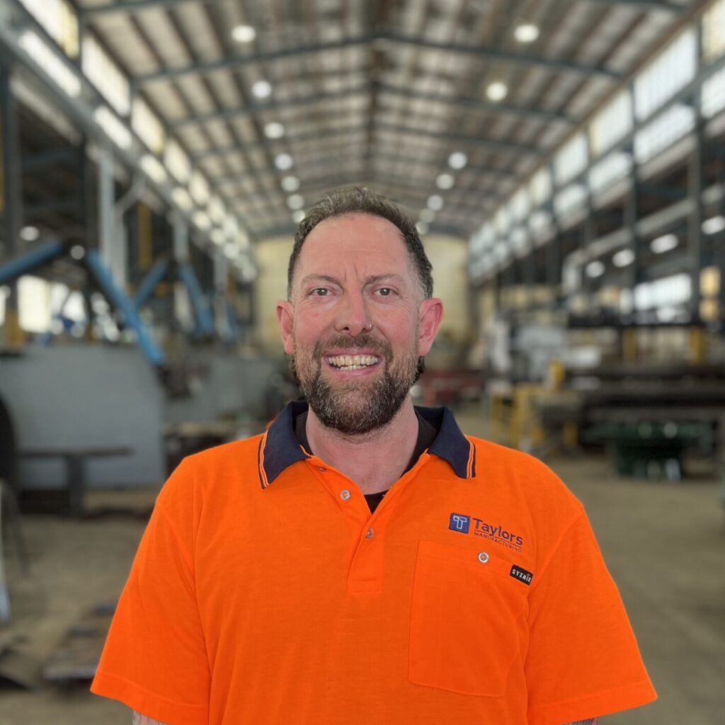 Sean Tomlinson Staff Photo Sean stands in workshop at Taylors Manufacturing